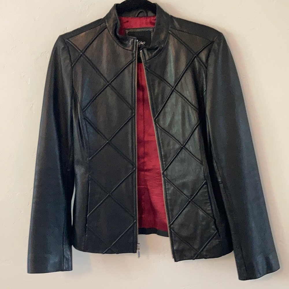 A black genuine leather jacket. Size small.